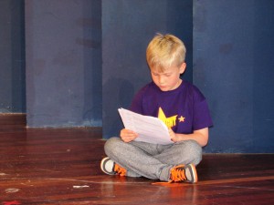 Mackenzie enjoying his book (or is it his script?!)